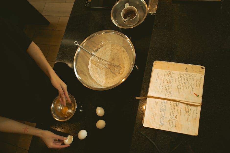 A kitchen scene of baking with ingredients and an open recipe book.