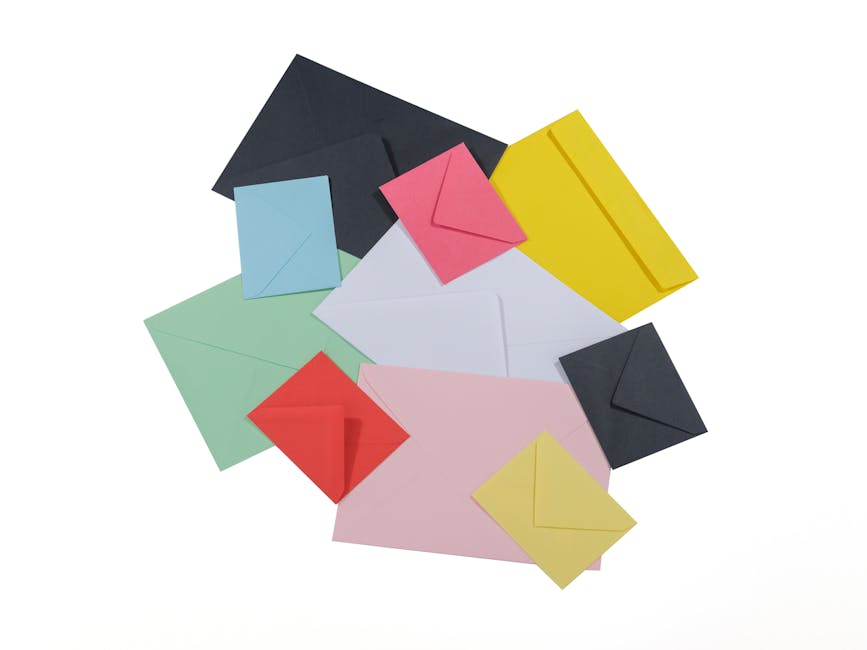 A vibrant assortment of multicolored envelopes arranged on a white surface.